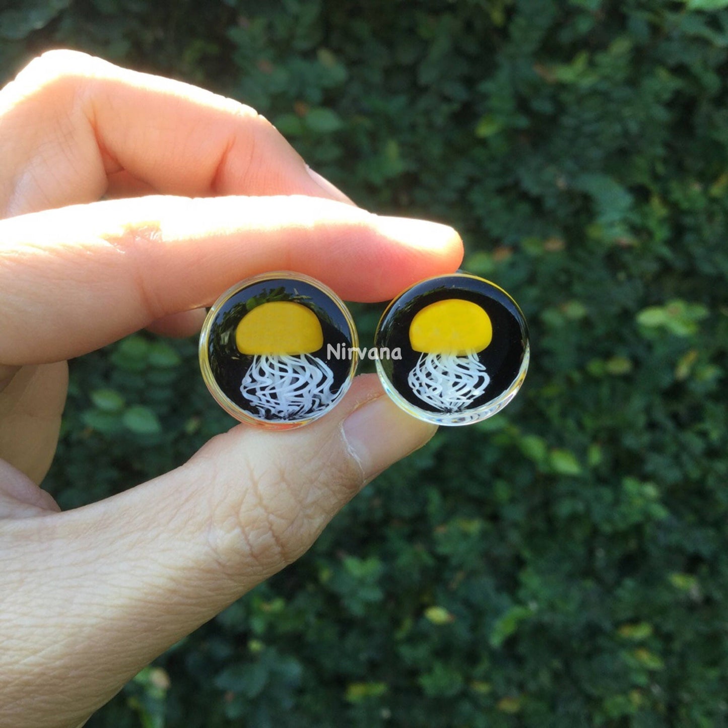 1 Pair (2 Pieces) Pyrex Glass Mustard Yellow Jellyfish Plugs Black Background