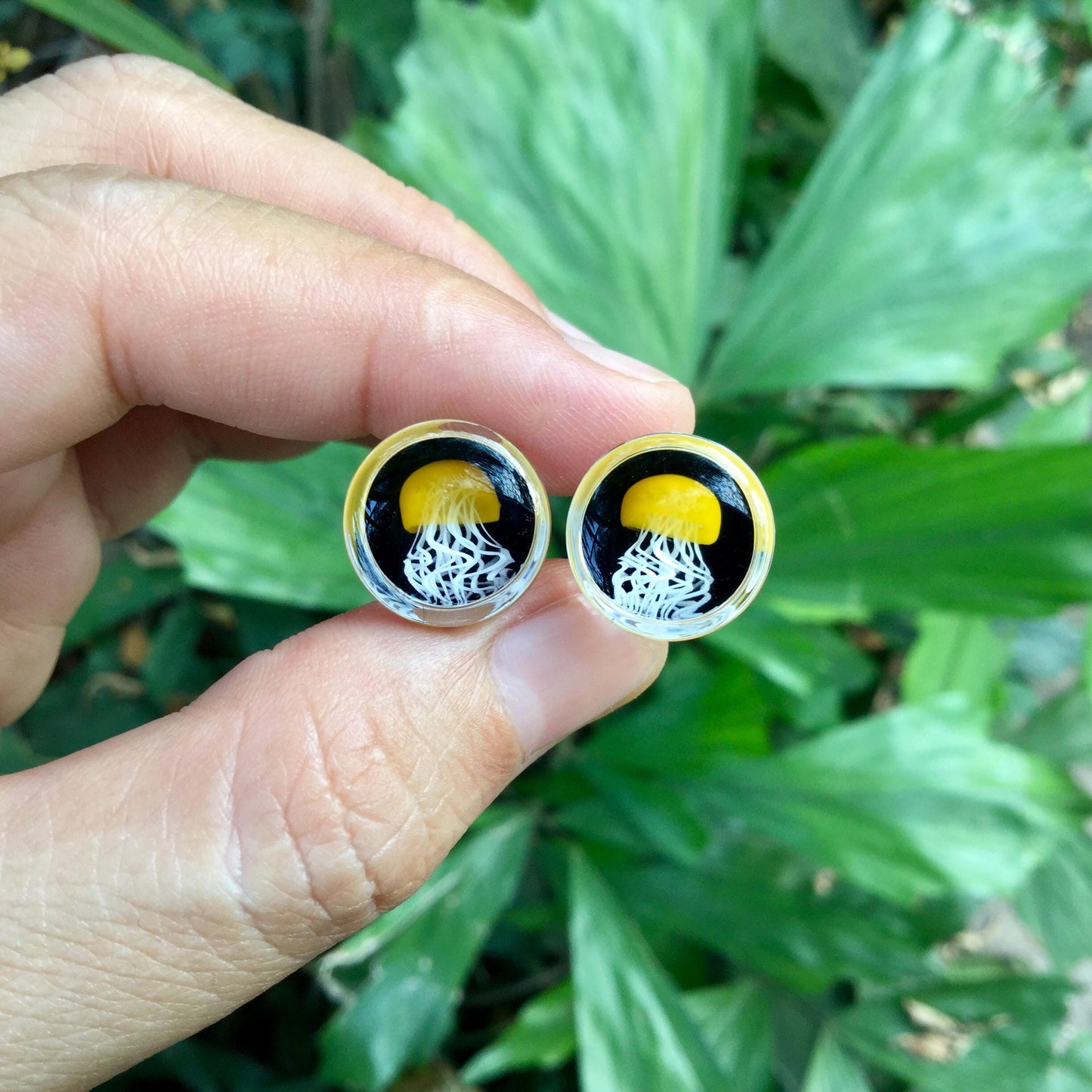 1 Pair (2 Pieces) Pyrex Glass Mustard Yellow Jellyfish Plugs Black Background