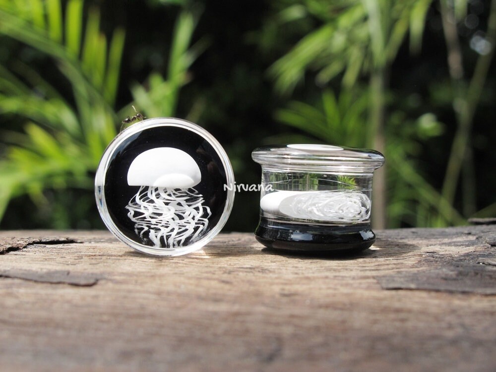 1 Pair (2 Pieces) Pyrex Glass White Jellyfish Plugs on Black Background