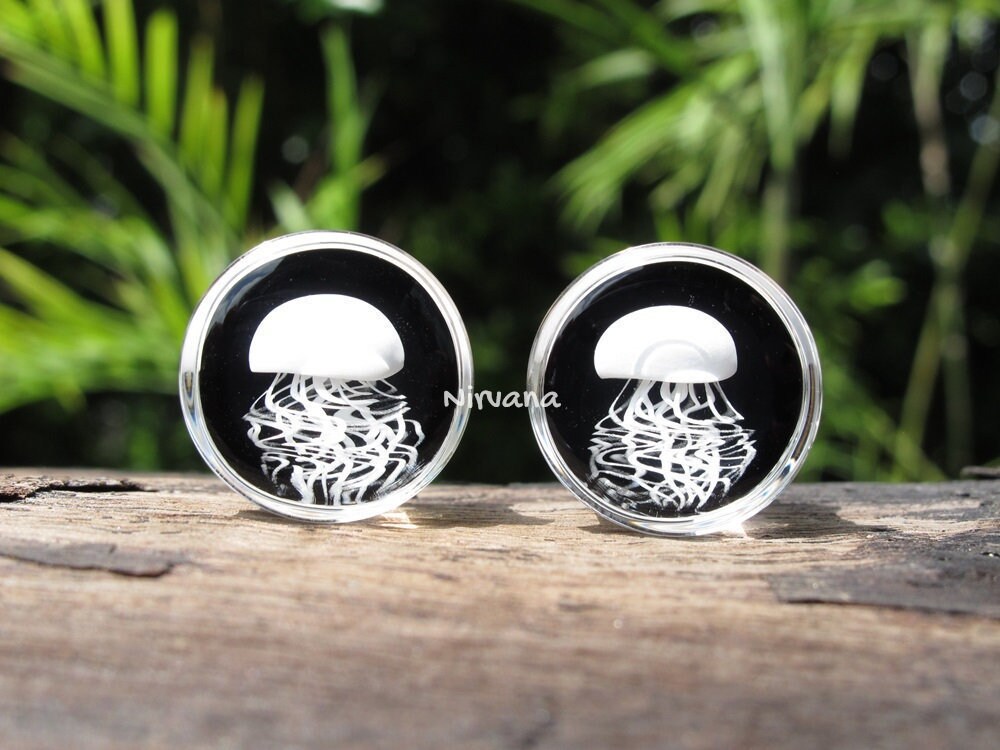 1 Pair (2 Pieces) Pyrex Glass White Jellyfish Plugs on Black Background
