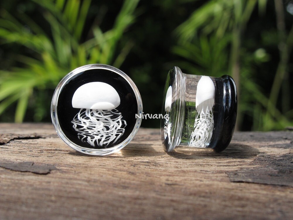 1 Pair (2 Pieces) Pyrex Glass White Jellyfish Plugs on Black Background