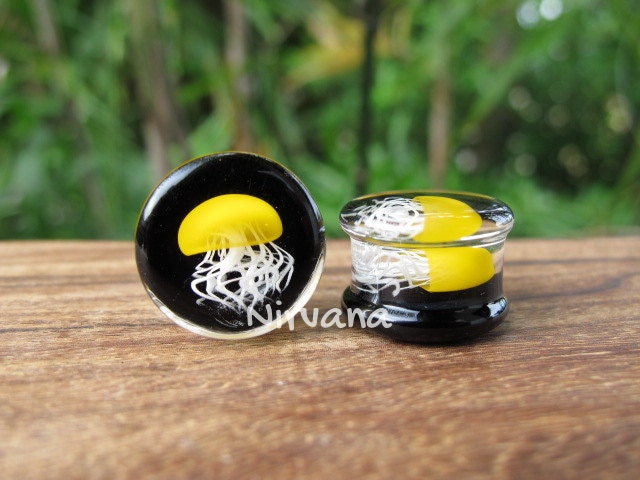 1 Pair (2 Pieces) Pyrex Glass Mustard Yellow Jellyfish Plugs Black Background