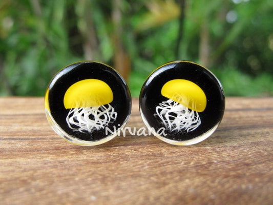 1 Pair (2 Pieces) Pyrex Glass Mustard Yellow Jellyfish Plugs Black Background